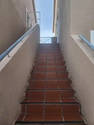 a stairway leading up to a building at 46 Atlanta - A Home away from Home in Strand