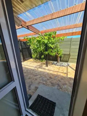 a view of a patio from a window at Kuku House in Cape Town