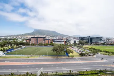 a view of a city with a mountain in the background at 723 Riverlands - Lux 1 bedroom Apartment in Cape Town