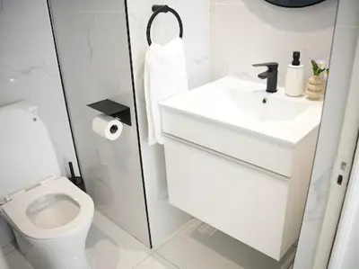 a white bathroom with a sink and a toilet at Cherrywood Guest House in Cape Town
