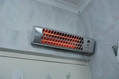 a metal vent on the wall of a bathroom at Townhouse in Bloubergstrand in Cape Town