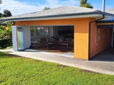 a house with a patio with a living room at Garden Pool Manor House in Kuilsrivier