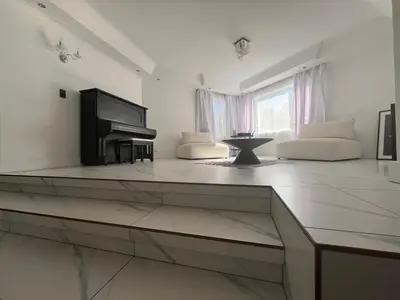 a living room with a television and a couch at 2 on Aurora Island in Durbanville