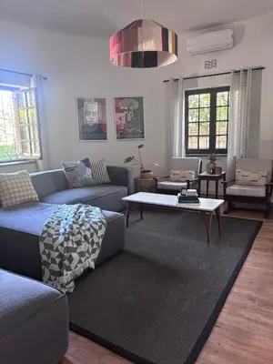 a living room with a couch and a coffee table at Catlovers Corner in Paarl