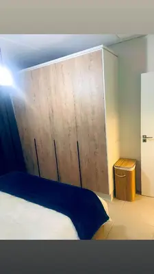 a bedroom with a bed with a large wooden headboard at Explore Convenience And Style In A Prime Location in Richwood