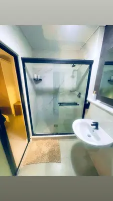 a bathroom with a shower and a sink at Explore Convenience And Style In A Prime Location in Richwood