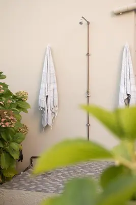 two towels are hanging on a wall at CalTye On Sea in Hermanus