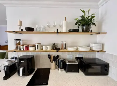 a kitchen with a counter top with appliances on it at The Sultan Cottage in Stellenbosch