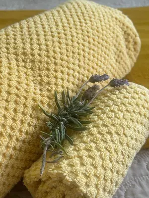 a yellow knit hat with a green plant on it at Waterberry Hideaway in Pringle Bay