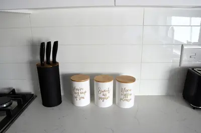 a kitchen counter with three knives and a knife block at Casa Voliere in Stellenbosch