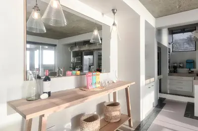 a kitchen with a wooden table in a room at Exclusive Estate, Panoramic Beauty, Watersports in Lake Marina