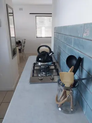 a tea kettle on a stove in a kitchen at Catch And Release Hermanus in Hermanus