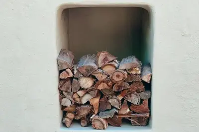 a pile of wood in a hole in a wall at The Sandpiper - The Alikreukel , Pringle Bay in Pringle Bay