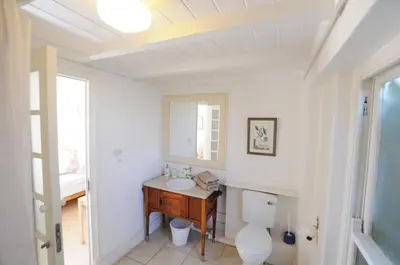 a bathroom with a toilet and a sink at Galileo Farm in Elgin