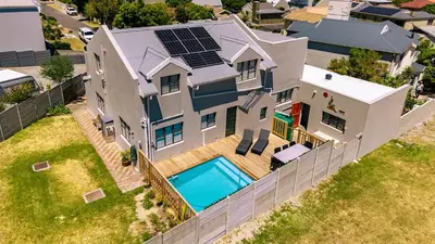 an overhead view of a house with a swimming pool at Onrus Family Retreat in Hermanus