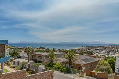 a view of the ocean from a house at 75 on Chapman in Gordonʼs Bay