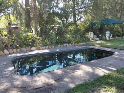 a swimming pool in the middle of a yard at Place of Old D in Eersterivier