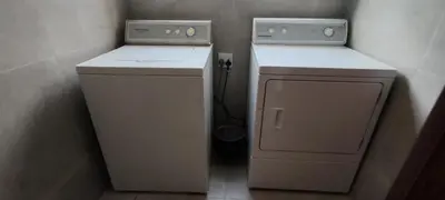 a small laundry room with a washer and dryer at 4 Molteno in Hermanus