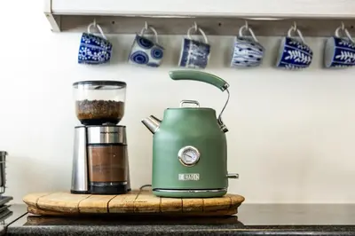 a green blender sitting on a counter next to a coffee maker at 5 Bedroom Family Home with Private Apartment in Hermanus