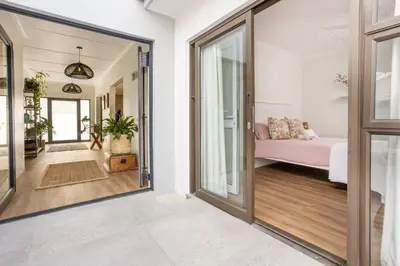 a hallway with a door leading to a bedroom at 5 Bedroom Family Home with Private Apartment in Hermanus