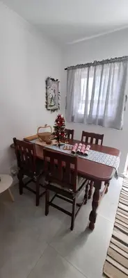 a dining room table and chairs with a christmas tree on it at Grey Vine Cottage - Flatlet in Cape Town