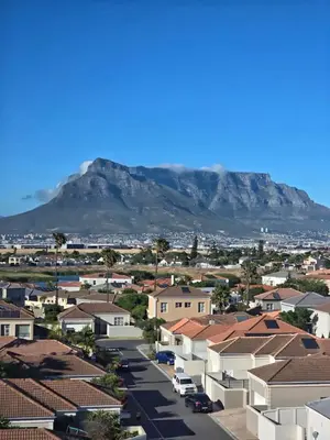 a city with houses and mountains in the background at Bella View in Cape Town