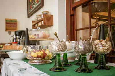 a table with four wine glasses on a table at 5 Seasons Guest House in Stellenbosch