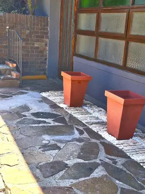 two orange containers sitting in front of a building at Central, Spacious GF Apartment, access to N1,N2,M5