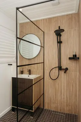a bathroom with a sink and a mirror at Hermanus Beach Club 218 in Hermanus