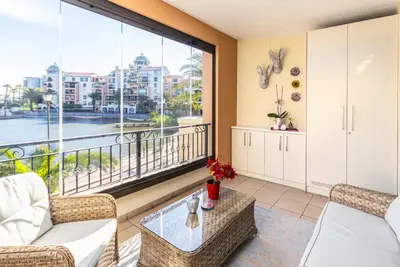 a living room with a view of the water at Family Oasis with Pool close to Shopping Center in Cape Town