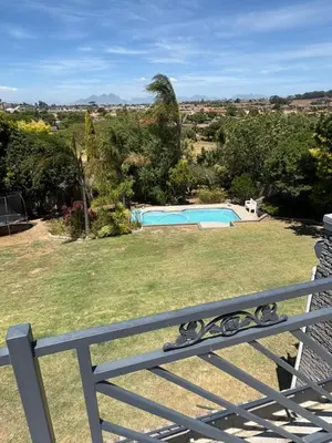a bench in a yard with a swimming pool at North of the vines in Oakdale