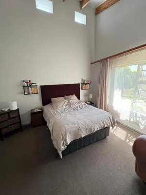 a bedroom with a large bed and a window at North of the vines in Oakdale