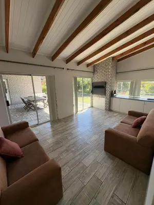 a living room with two couches and a fireplace at North of the vines in Oakdale