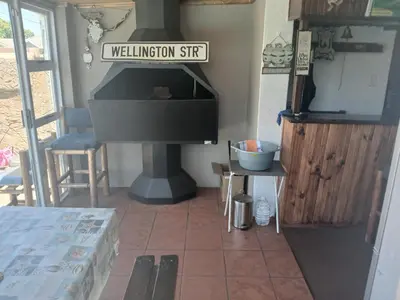 a living room with a piano in a room at Braai and chill getaway in Goodwood