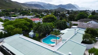 an aerial view of a house with a swimming pool at Northcliff House in Hermanus