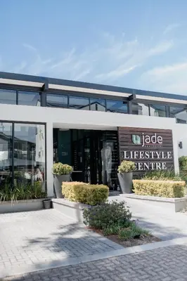 a building with a sign that reads village lifestyle centre at Luxury Coastal Escape in Strand in Somerset West