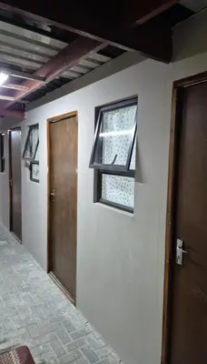 a room with a door and a window on a wall at The Lavender Residence in Belhar