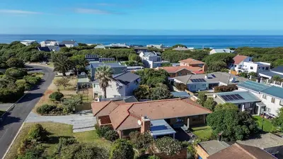 an aerial view of a small town with houses at Sandbaai Breeze in Hermanus