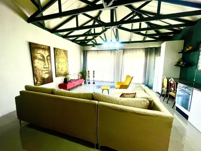 a living room with a large couch in a room at Blouberg kiters in Cape Town