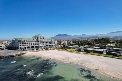 an aerial view of a beach and buildings at Fleurpark 6 in Gordonʼs Bay