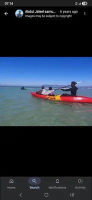 a picture of a person in a kayak in the water at On The Bay in Strandfontein