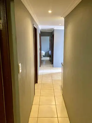 a hallway of a room with a tile floor at Unit 3 TraversHub Sleeps 6 Self-Catering Group Belhar, CT in Belhar