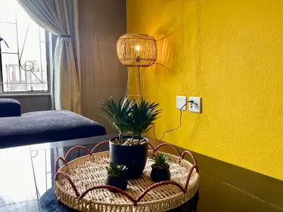 a room with a table with potted plants on it at Unit 3 TraversHub Sleeps 6 Self-Catering Group Belhar, CT in Belhar