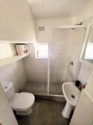 a bathroom with a toilet and a sink at Offbeat off Dorp in Stellenbosch
