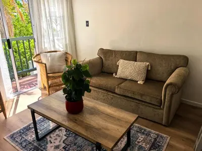 a living room with a couch and a coffee table at Offbeat off Dorp in Stellenbosch
