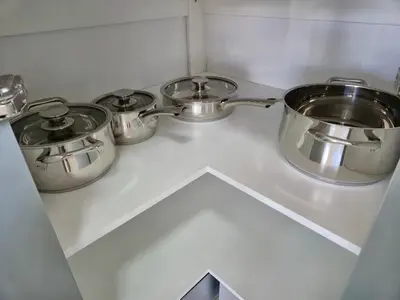 three pots and pans on a counter in a kitchen at Sand & Sea Studio Hermanus in Hermanus