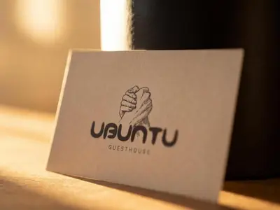 a white card with a picture of a hand at Guesthouse Ubuntu - Stellenbosch in Stellenbosch