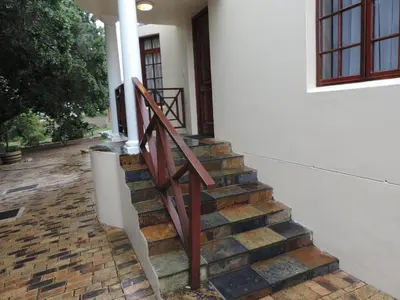 a set of stairs leading to a house at Milkwood Lodge in Hermanus