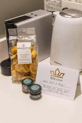 a box of bagels next to a toaster at Winelands Luxury Unit in Stellenbosch