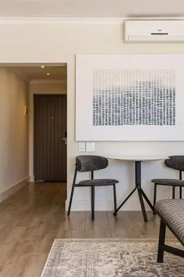 a meeting room with two chairs and a table at Winelands Luxury Unit in Stellenbosch